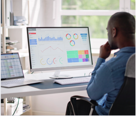 Business professional reviewing Zoho dashboard